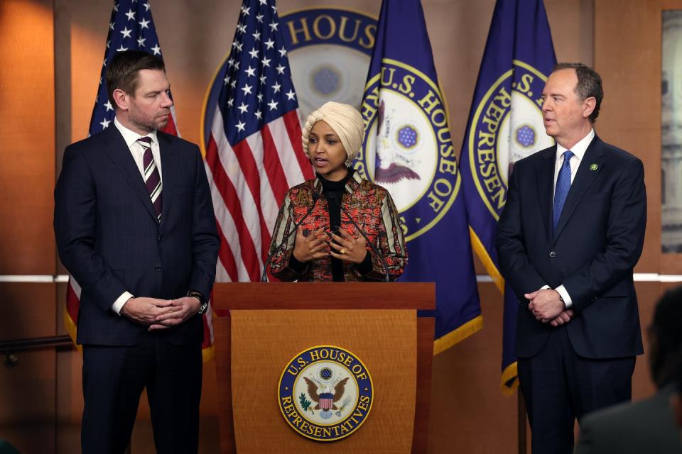 U.S. Reps. Ilhan Omar (center), Eric Swalwell (left) and Adam Schiff speak at a press conference about congressional committee assignments. <a href="https://www.gettyimages.com/detail/news-photo/rep-ilhan-omar-joined-by-rep-eric-swalwell-and-rep-adam-news-photo/1459406501?adppopup=true" rel="nofollow noopener" target="_blank" data-ylk="slk:Kevin Dietsch via Getty Images News;elm:context_link;itc:0;sec:content-canvas" class="link ">Kevin Dietsch via Getty Images News</a>