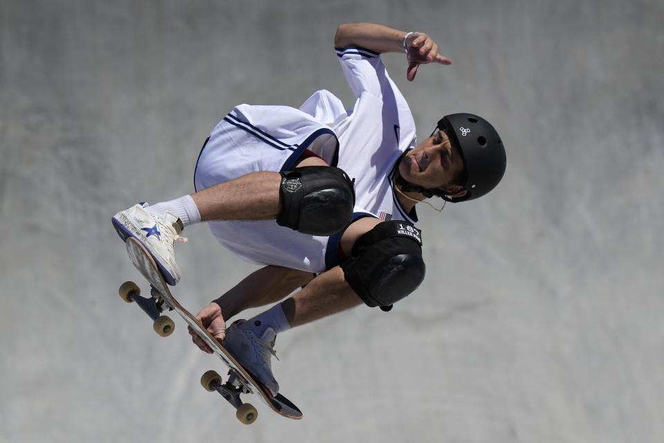 Cory Juneau of the United States competes in the men's park skateboarding prelims at the 2020 Summer Olympics, Thursday, Aug. 5, 2021, in Tokyo, Japan. (AP Photo/Ben Curtis)