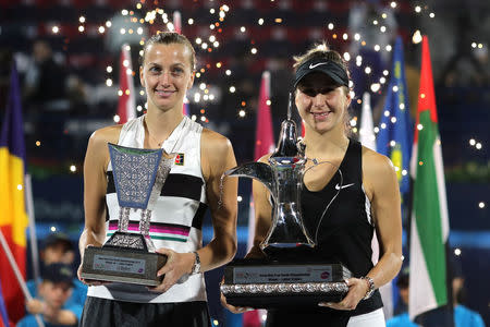 Tennis - WTA Premier 5 - Dubai Tennis Championships - Dubai Duty Free Tennis Stadium, Dubai, United Arab Emirates - February 23, 2019 Switzerland's Belinda Bencic celebrates with a trophy after winning the final alongside runner up Petra Kvitova of Czech Republic REUTERS/Ahmed Jadallah