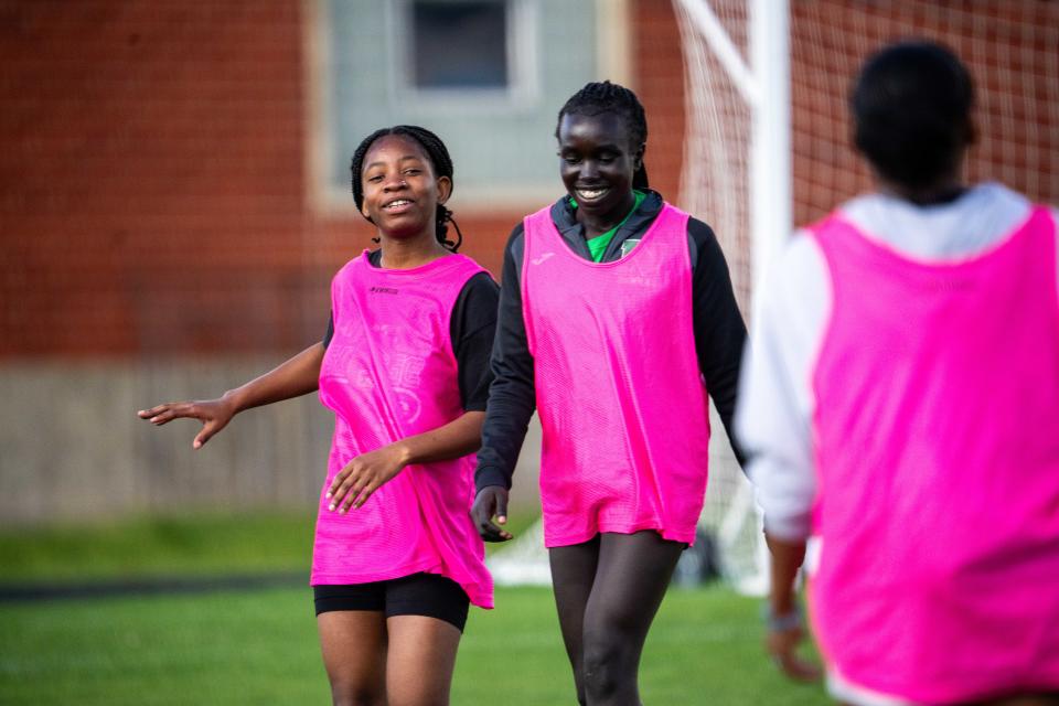 North soccer players Vick Lumanya (left) and Adar Mangok (right) take part in practice on April 18 in Des Moines.