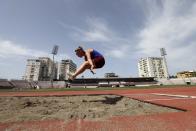 Ukrainian athlete Maria Strielets, 15, practices during a training session at Elbasan Arena stadium in Elbasan, about 45 kilometers (30 miles) south of Tirana, Albania, Monday, May 9, 2022. After fleeing from a war zone, a group of young Ukrainian track and field athletes have made their way to safety in Albania. Their minds are still between the two countries. (AP Photo/Franc Zhurda)