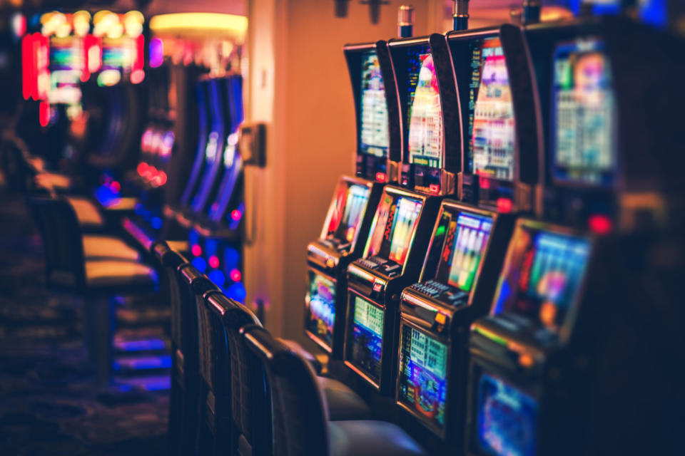 Slot machines lined up in a casino.