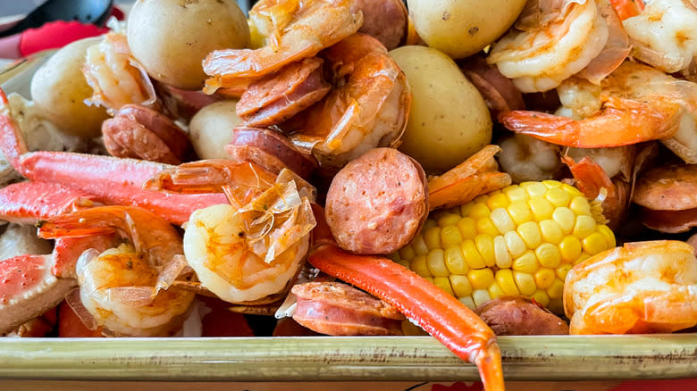 Shrimp, potatoes, crab legs, and corn