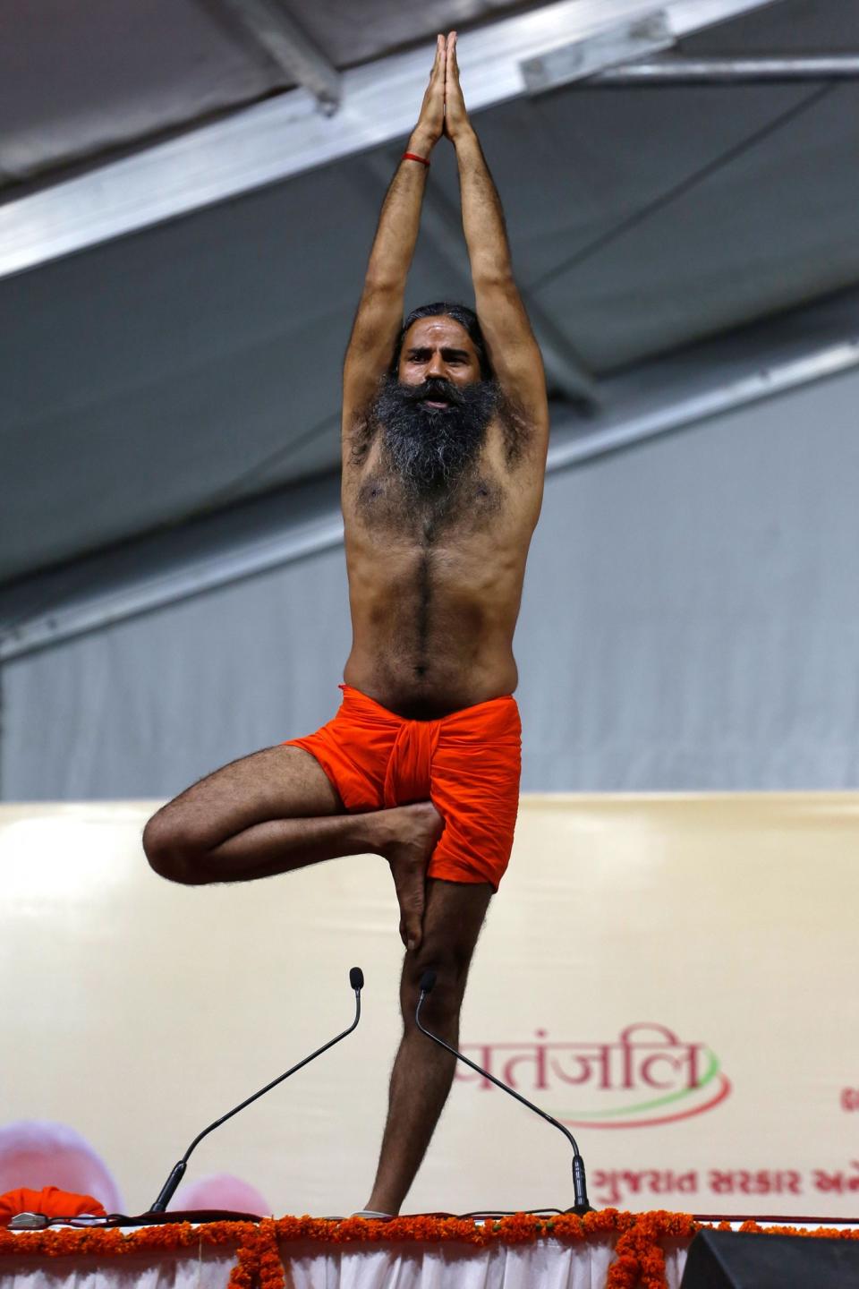 <p>Yoga guru Baba Ramdev performs Yoga during International Yoga Day celebrations in Ahmadabad, India, Wednesday, June 21, 2017. (Photo: Ajit Solanki/AP) </p>