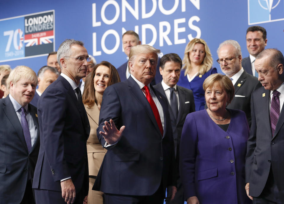 FILE - U.S. President Donald Trump, center, gestures as he walks off the podium after a group photo at a NATO leaders meeting at The Grove hotel and resort in Watford, Hertfordshire, England, Wednesday, Dec. 4, 2019. Trump says he once warned that he would allow Russia to do whatever it wants to NATO member nations that are “delinquent” in devoting 2% of their gross domestic product to defense. Trump’s comment on Saturday represented the latest instance in which the former president and Republican front-runner seemed to side with an authoritarian state over America’s democratic allies. (Peter Nicholls, Pool Photo via AP, File)