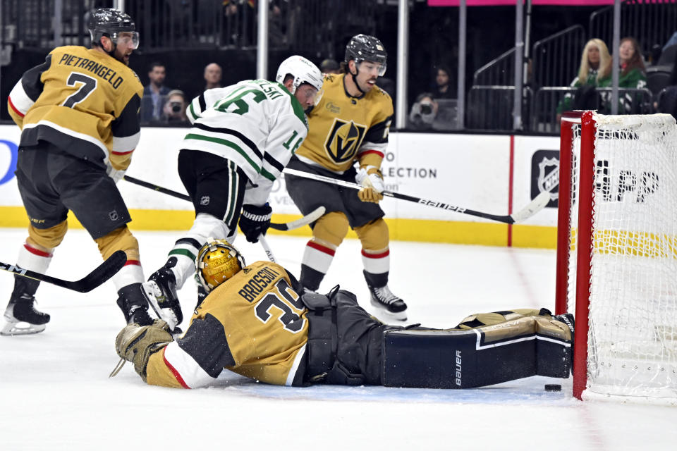 Vegas Golden Knights goaltender Laurent Brossoit (39) defends against the Dallas Stars during the first period of an NHL hockey game Saturday, Feb. 25, 2023, in Las Vegas. (AP Photo/David Becker)