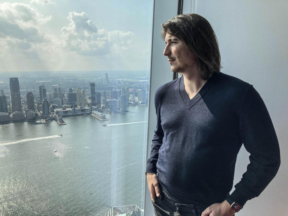 Robinhood CEO Vlad Tenev poses for a picture during an interview about the company that introduced a new generation of investors into the stock market and forced the industry to stop charging fees for trading, Wednesday, July 28, 2021, in New York. Shares of Robinhood Markets are set to begin trading on the Nasdaq for the first time Thursday. (AP Photo/David R. Martin)