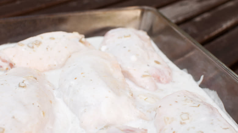 Raw chicken soaking in milk