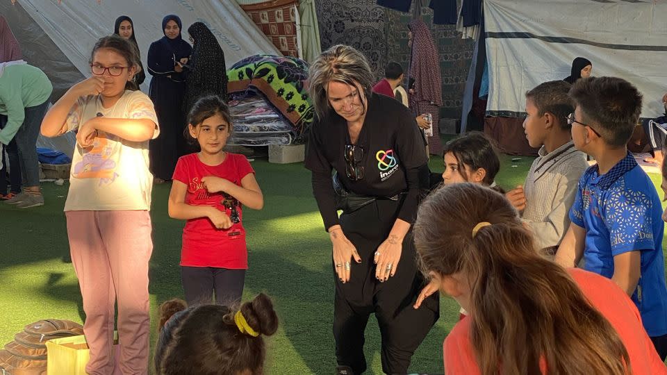Arwa Damon leads an activity with children at one of the shelters where INARA provides services in southern Gaza. - Arwa Damon/INARA