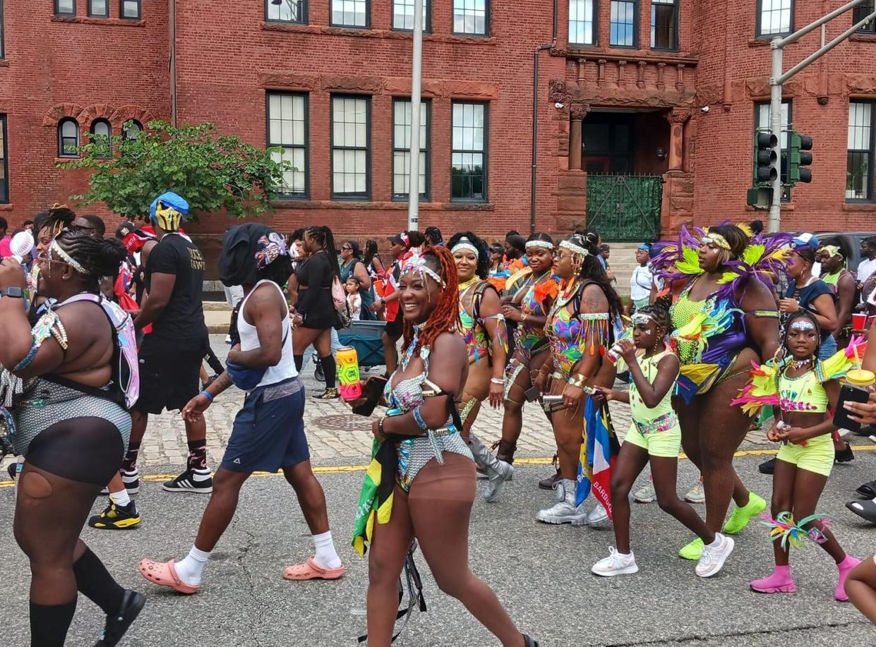 Costumed revelers participated in the Worcester Caribbean parade, which made its way Aug. 27, 2023, from City Hall to Institute Park for the Worcester Caribbean American Carnival.
