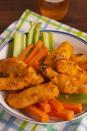 <p>Ever just wish there was more chicken on a wing? These tender (literal) tenders are just that. And best of all, they're gluten-free!</p><p>Get the <strong><a href="https://www.delish.com/cooking/recipe-ideas/recipes/a57755/buffalo-chicken-tenders-recipe/" rel="nofollow noopener" target="_blank" data-ylk="slk:Buffalo Chicken Tenders recipe;elm:context_link;itc:0;sec:content-canvas" class="link ">Buffalo Chicken Tenders recipe</a></strong>. </p>