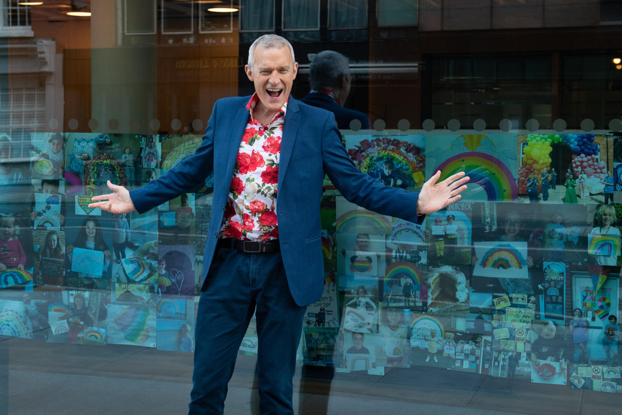 Jeremy Vine with rainbow pictures sent in by viewers of his Channel 5 show, on display in the windows of the ITN building, in central London, in tribute to the key workers battling the coronavirus outbreak. (Photo by Dominic Lipinski/PA Images via Getty Images)