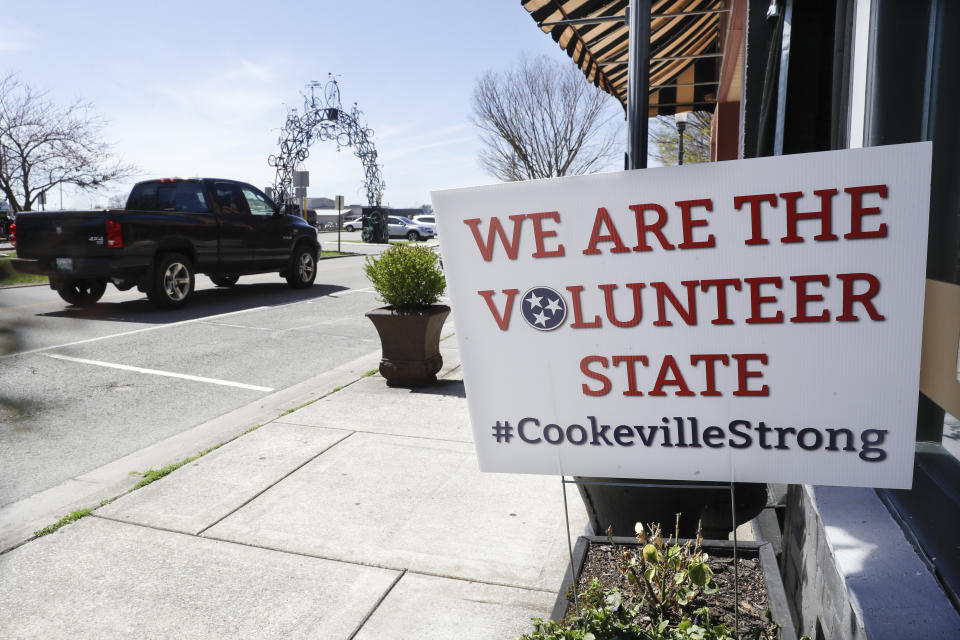 In this March 26, 2020, photo, a sign with an inspirational message is displayed in Cookeville, Tenn. People still reeling from the deadly twisters that hit the state on March 3 now have to confront life in the age of coronavirus. (AP Photo/Mark Humphrey)