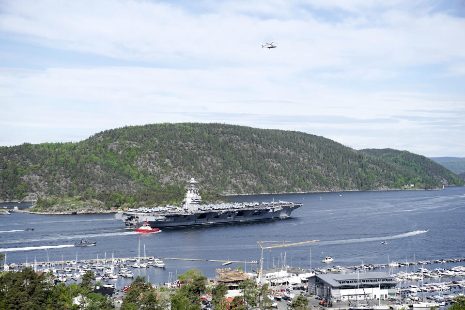 The aircraft carrier USS Gerald R. Ford passes on its way to the Oslo Fjord, at Drobak, Norway, Wednesday, May 24, 2023. The ship is the world's largest warship and will be in port of Oslo for four days. (Terje Pedersen/NTB Scanpix via AP)