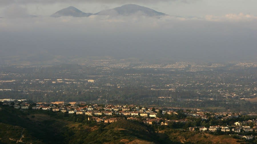 <em>The urban sprawl that has filled most of Orange County spreads out in front of a ridge in Laguna Coast Wilderness Park, part of a nearly 40,000-acre swath of Orange County open space, south of Irvine, California.</em> (Photo by David McNew/Getty Images)