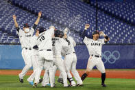 <p>YOKOHAMA, JAPAN - AUGUST 02: Team Japan celebrates after Takuya Kai #10 hit a game-winning single in the tenth inning to defeat Team United States 7-6 during the knockout stage of men's baseball on day ten of the Tokyo 2020 Olympic Games at Yokohama Baseball Stadium on August 02, 2021 in Yokohama, Kanagawa, Japan. (Photo by Koji Watanabe/Getty Images)</p> 