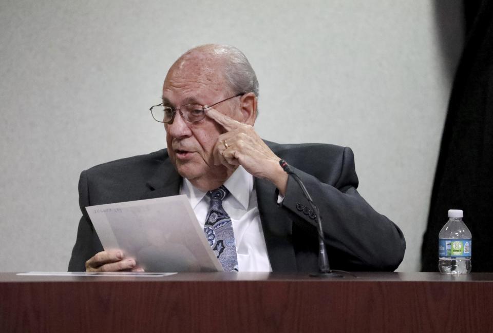 Former Tampa police captain Curtis Reeves points to his left eye while providing details for the jury about the moments surrounding the shooting of Chad Oulson during his second-degree murder trial on Thursday, Feb 24, 2022, at the Robert D. Sumner Judicial Center in Dade City, Fla. Reeves is accused of shooting and killing Chad Oulson at a Wesley Chapel movie theater in January 2014. (Douglas R. Clifford/Tampa Bay Times via AP, Pool)