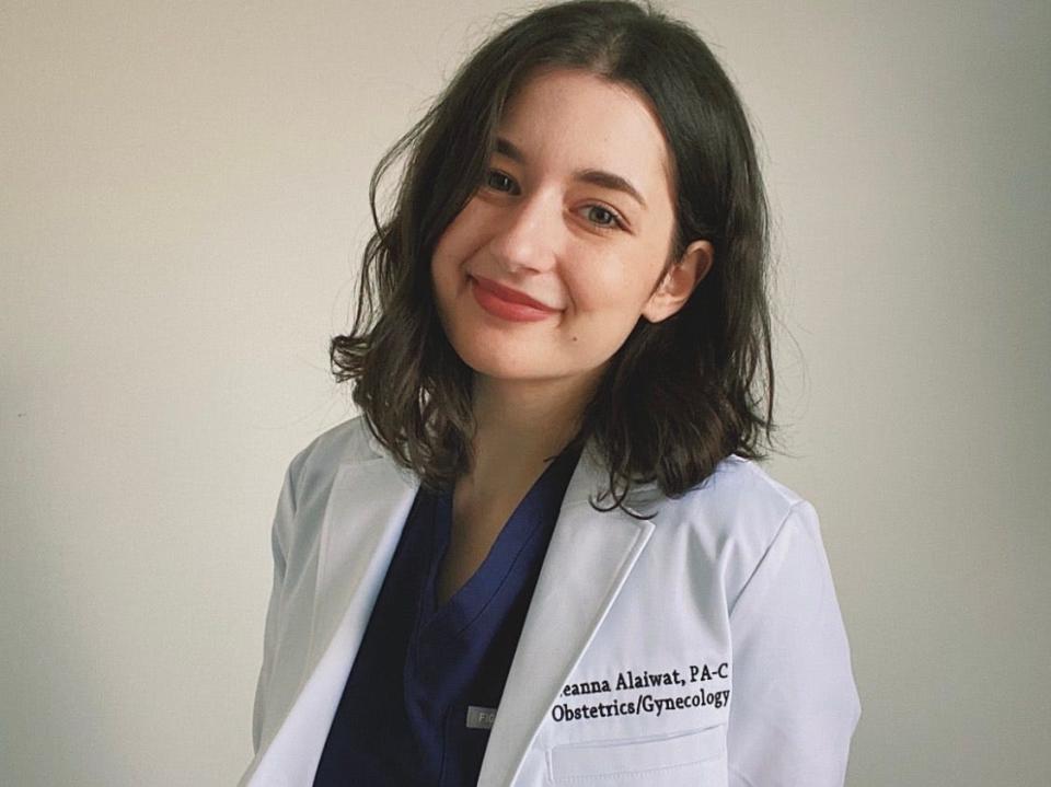 Physician Assistant Leanna Alaiwat in white coat smiling for the camera