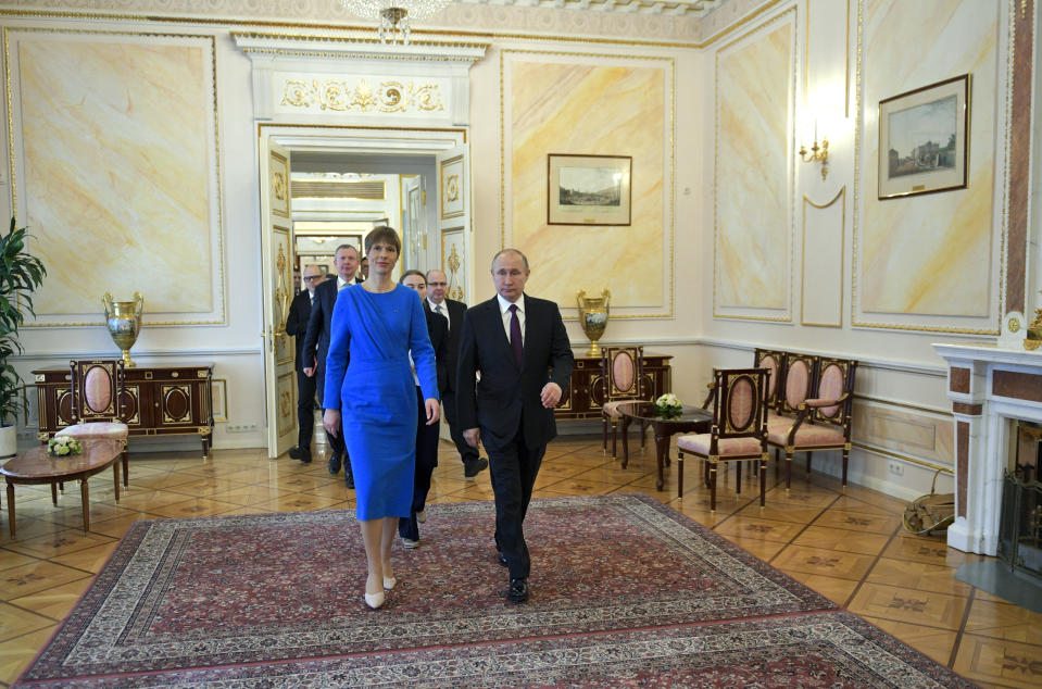 Russian President Vladimir Putin, right, and Estonia's President Kersti Kaljulaid walk inside the Kremlin in Moscow, Russia, Thursday, April 18, 2019.Thursday's meeting between the presidents of Russia and Estonia is the first one for the leaders of the two neighboring countries in nearly a decade. (Alexei Druzhinin, Sputnik, Kremlin Pool Photo via AP)