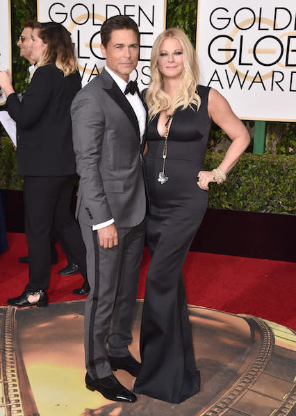 Rob Lowe in a gray and black tuxedo at the 73rd Golden Globe Awards.