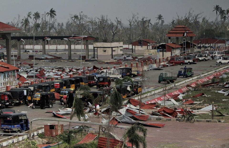 Corrugated sheets used as roofing lie scattered after Cyclone Fani made landfall in the area in Penthakata fishing village of Puri, in the eastern Indian state of Orissa, Saturday, May 4, 2019. A mammoth preparation exercise that included the evacuation of more than 1 million people appears to have spared India a devastating death toll from one of the biggest storms in decades, though the full extent of the damage was yet to be known, officials said Saturday. (AP Photo)