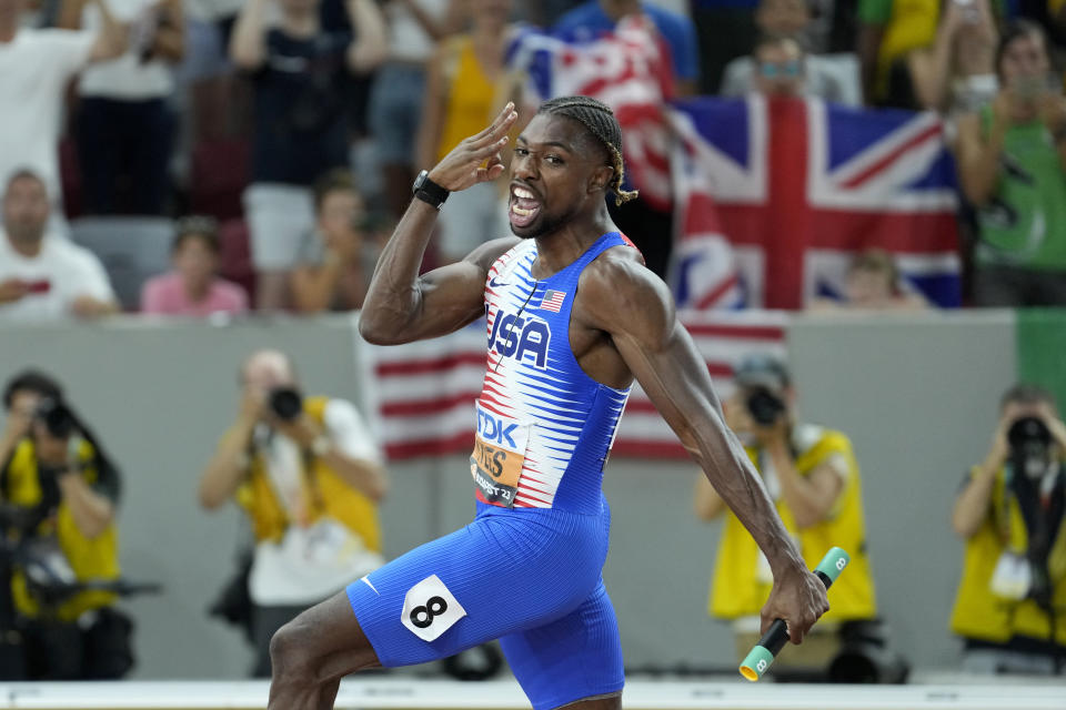 Noah Lyles, from the United States, gestures after crossing the finish line to win the gold medal in the Men's 4 X 100-meters relay final during the World Athletics Championships in Budapest, Hungary, Saturday, Aug. 26, 2023.(AP Photo/Matthias Schrader)