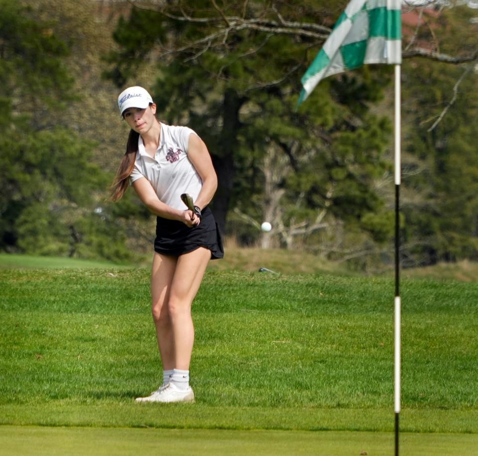 La Salle's Olivia Williams follows her shot as she chips up to the green and into the cup on the 4th hole Monday afternoon.