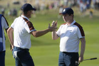 Europe's Justin Rose, left and playing partner Europe's Robert Macintyre celebrate on the 10th green during their afternoon Fourballs match at the Ryder Cup golf tournament at the Marco Simone Golf Club in Guidonia Montecelio, Italy, Saturday, Sept. 30, 2023. (AP Photo/Andrew Medichini)