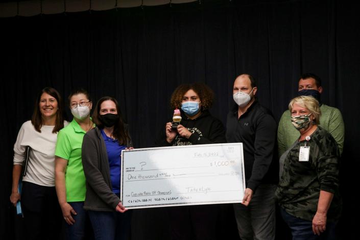 The Harrison High School team poses for a photo with their first prize check after winning the Cupcake Bake Off at the Greater Lafayette Career Academy, Wednesday, Feb. 16, 2022 in Lafayette.