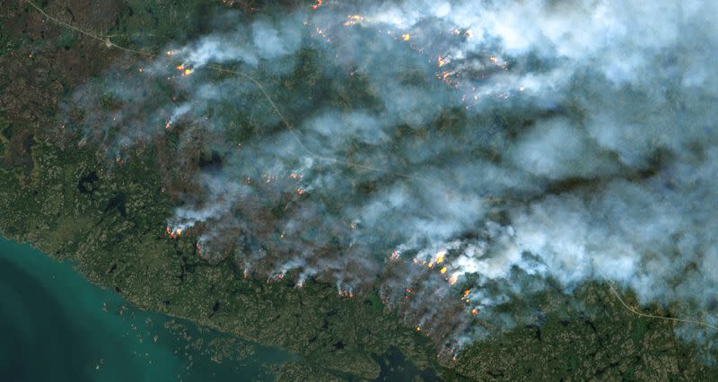 A satellite image shows wildfires burning near Yellowknife