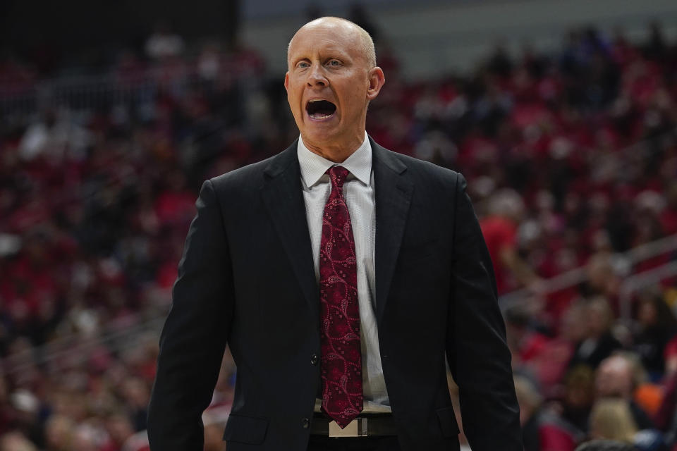 FILE - Louisville head coach Chris Mack reacts to a play during the second half of an NCAA college basketball game against Virginia Tech, Sunday, March 1, 2020 in Louisville, Ky. (AP Photo/Bryan Woolston, File)