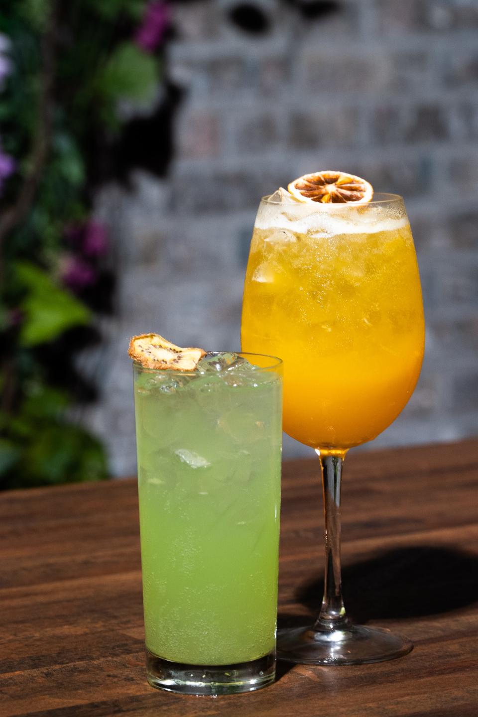 Summery cocktails, like the Kiwis Big Adventure (left) and Passion Fruit Spritz, are served at The Loaded Spoon in Freehold.