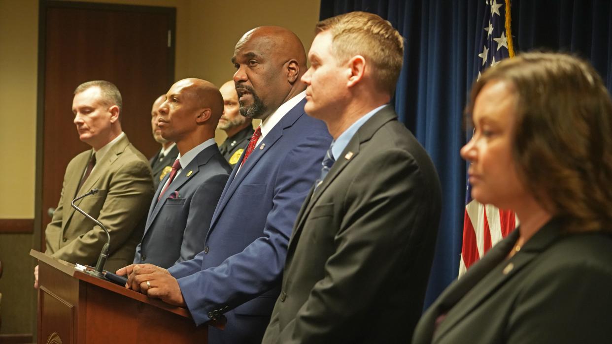 U.S. Attorney Kenneth L. Parker (center) speaks about the plea of Banmeet Singh, 40, who ran a dark web narcotics conspiracy that used Columbus as a hub. Singh, the ringleader, was extradited from the United Kingdom in March 2023.