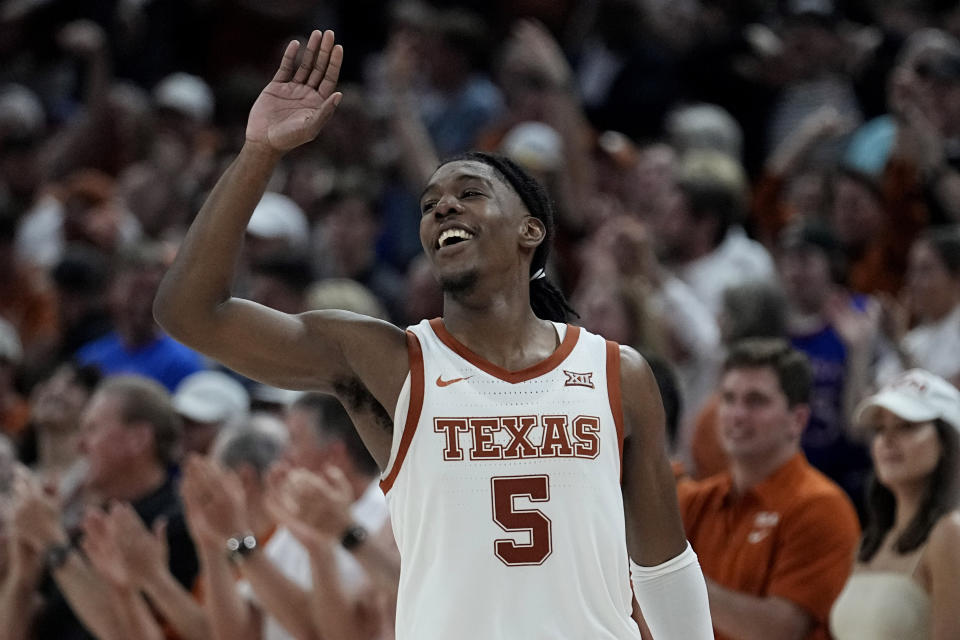 FILE - Texas guard Marcus Carr (5) celebrates a play during the second half of an NCAA college basketball game against Kansas in Austin, Texas, Saturday, March 4, 2023. Carr was selected to The Associated Press All-Big 12 Conference team in voting released Tuesday, March 7, 2023.(AP Photo/Eric Gay, File)
