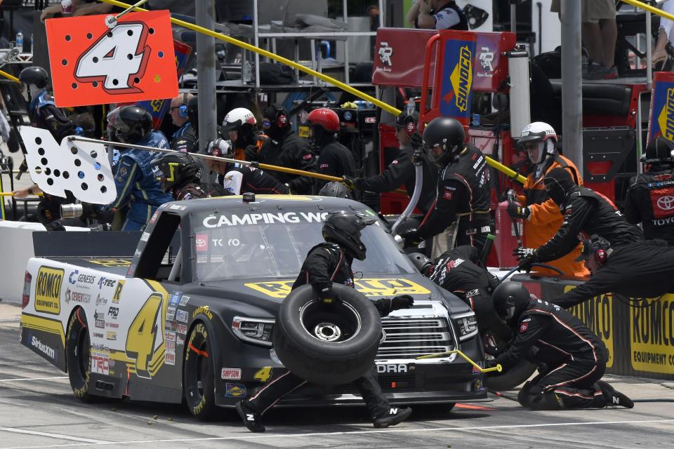 John Hunter Nemechek makes a pit stop during a NASCAR Truck Series auto race at Texas Motor Speedway in Fort Worth, Texas, Saturday, June 12, 2021. (AP Photo/Larry Papke)