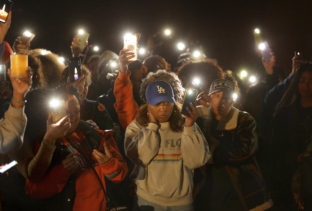 Scores of friends and family attend a vigil for Sierra Jenkins on Sunday, March 20, 2022, at Granby High School in Norfolk, Va. Jenkins, a reporter for the Virginian-Pilot died at a Norfolk hospital after being shot during a shooting early Saturday outside a restaurant and bar. (Stephen M. Katz/The Virginian-Pilot via AP)