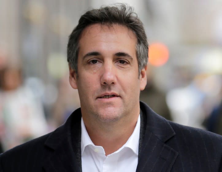 FILE - In this April 11, 2018, file photo, Michael Cohen, President Donald Trump's former attorney, walks along a sidewalk in New York. Cohen will testify publicly before Congress in February 2019. (AP Photo/Seth Wenig, File)