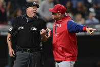 Los Angeles Angels interim manager Phil Nevin, right, argues with home plate umpire Ron Kulpa after being ejected during the seventh inning of a baseball game against the Cleveland Guardians, Monday, Sept. 12, 2022, in Cleveland. The Guardians won 5-4. (AP Photo/David Dermer)