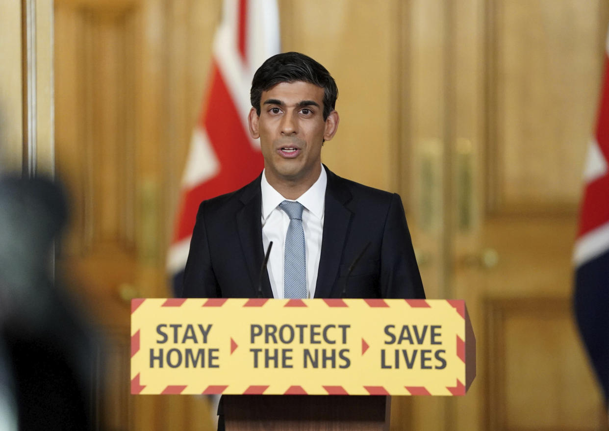 In this handout photo provided by 10 Downing Street, Britain's Chancellor of the Exchequer Rishi Sunak speaks during a media briefing on coronavirus in Downing Street, London, Monday April 20, 2020. (Pippa Fowles/10 Downing Street via AP)