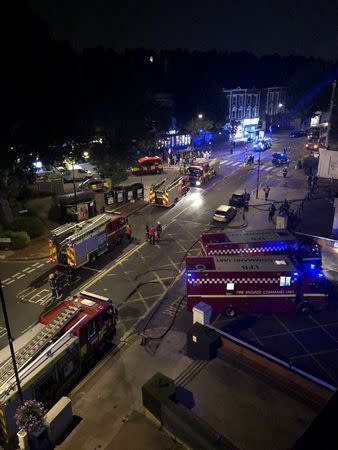 Fire engines and firefighters arrive at the site where a block of flats has caught on fire in West Hampstead, London, England, July 26, 2018 in this picture obtained from social media. Hayley Smith/via REUTERS