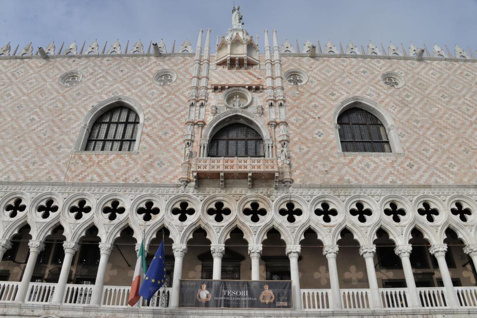 FILE - In this Wednesday, Jan. 3, 2018 file photo, a poster indicating the exhibition 'Treasures of the Mughals and the Maharajahs' hangs from Venice's Doge's Palace, in Venice, Italy. In January 2018, thieves stole precious Indian jewels from the famed Al Thani Collection that were on show at the Doge's Palace in Venice, including a pendant featuring a 10-carat diamond. A brazen burglary on Monday Nov. 25, 2019 from Dresden’s Green Vault, one of the world’s oldest museums, holding priceless treasures is another in a long history of daring European heists over the years. (Andrea Merola/ANSA via AP, File)