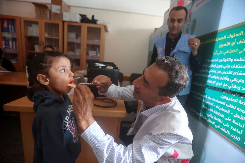 FILE PHOTO: Gaza doctor travels on his bicycle to help displaced patients amid fuel shortages