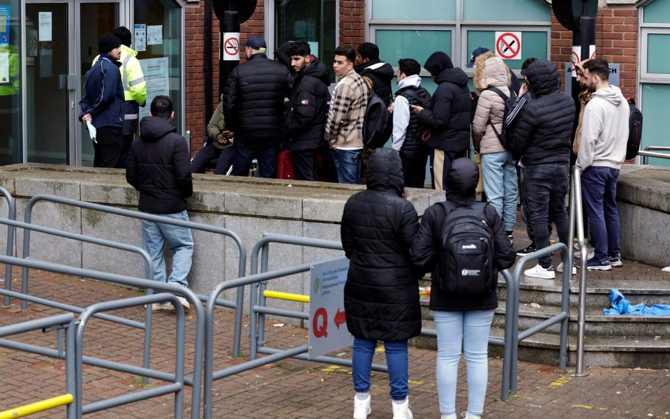 Asylum seekers line up outside the International Protection Office in the hope of getting an appointment