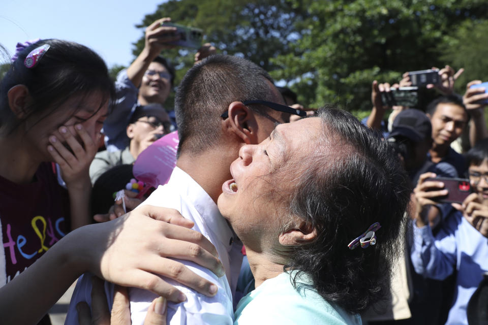 Kaung Sett Lin, center, photojournalist, is welcomed by family members and colleagues after he was released Insein Prison in Yangon, Myanmar, Thursday, Jan. 4, 2024. Myanmar’s military government on Thursday pardoned nearly 10,000 prisoners to mark the 76th anniversary of gaining independence from Britain, but it wasn’t immediately clear if any of those released included the thousands of political detainees jailed for opposing army rule.(AP Photo/Thein Zaw)