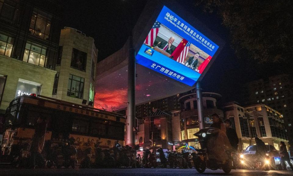 A screen in a Beijing street shows Xi Jinping and Joe Biden in talks via videolink last November