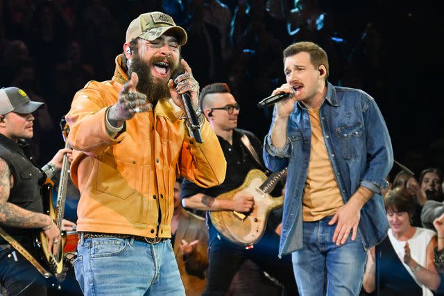 <p>Astrida Valigorsky/WireImage</p> Post Malone and Morgan Wallen perform at the CMA Awards in Nashville in November 2023