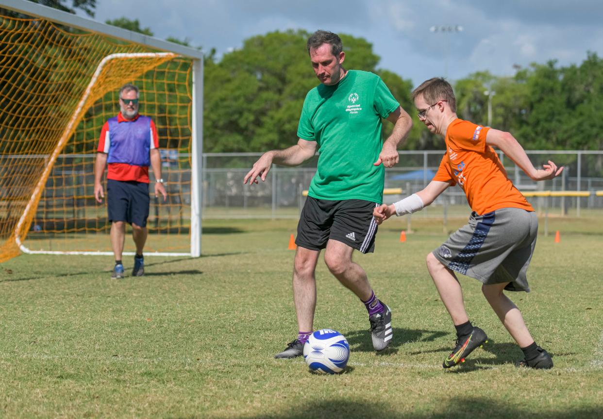 Chris Yandell, left, and Sidge Taylor play soccer at the Susan Street Sports Complex in Leesburg on Saturday, May 7, 2022. [PAUL RYAN / CORRESPONDENT]