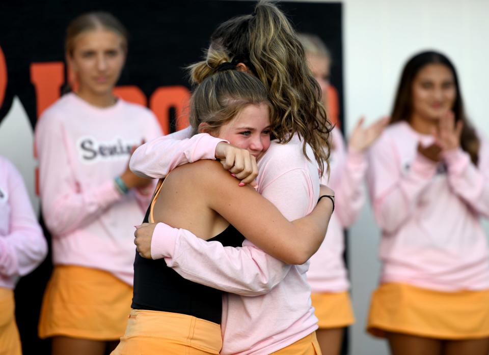 Hoover sophomore Addy Sheil hugs senior Tess Bucher during the team's senior night, Wednesday, Sept 20, 2023.