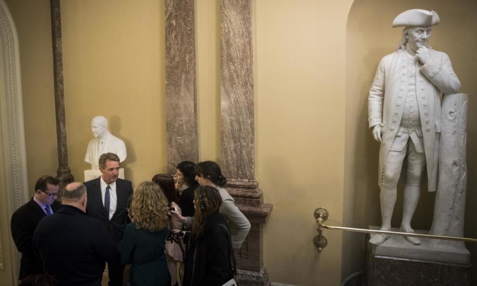 Senator Jeff Flake talks to reporters.