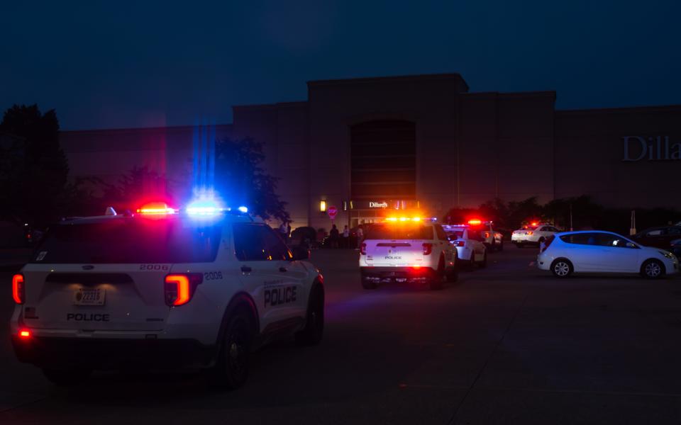 Evansville Police Department squad cars with lights flashing lined up outside Eastland Mall Sunday, May 14, 2023, after a large fight reportedly broke out and resulted in a heavy response from law enforcement.